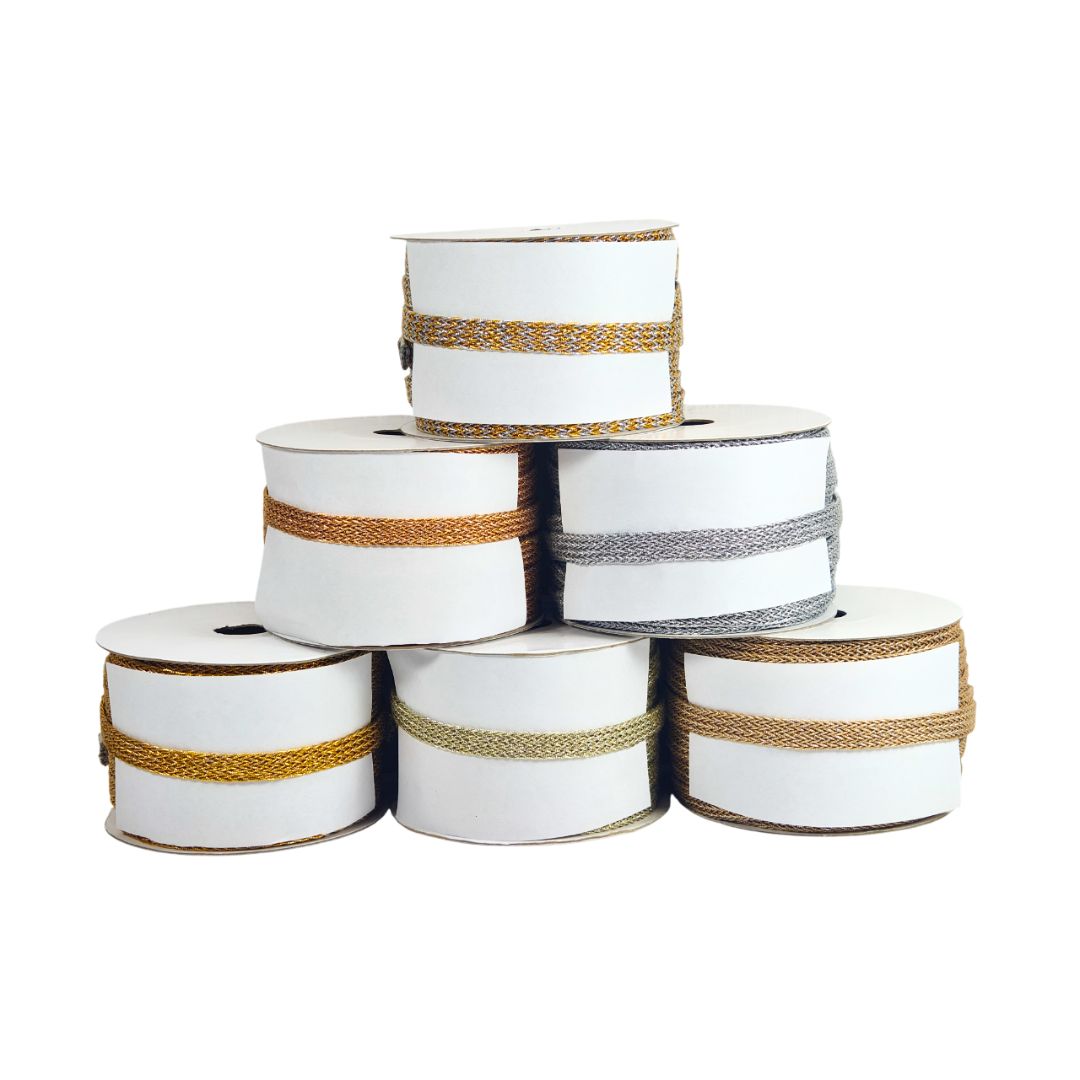 Stack of white spools with brown and black ribbons on a white background