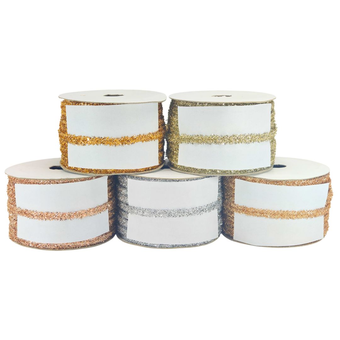 Five spools of ribbon with gold and silver glitter stripes on a white background