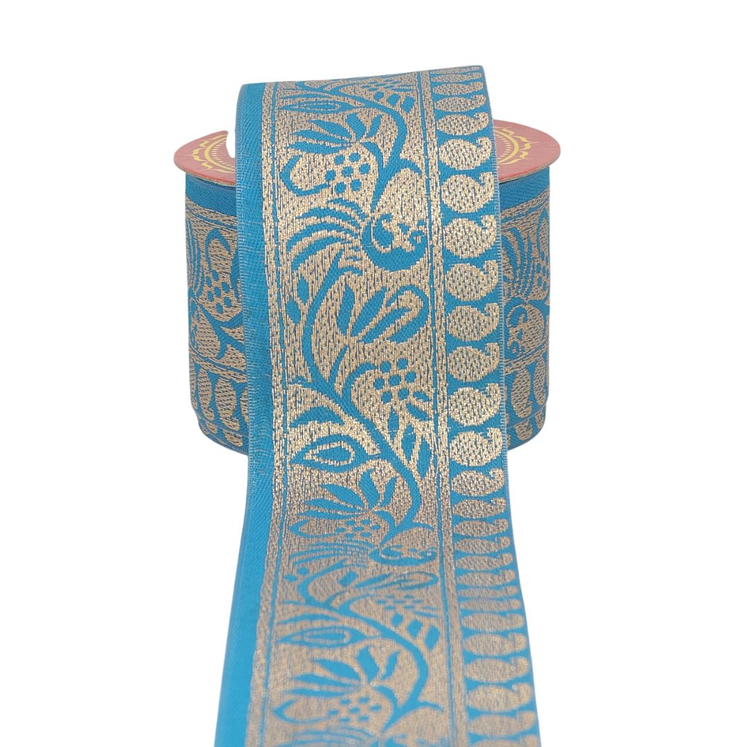 Roll of blue and beige patterned fabric on a white background