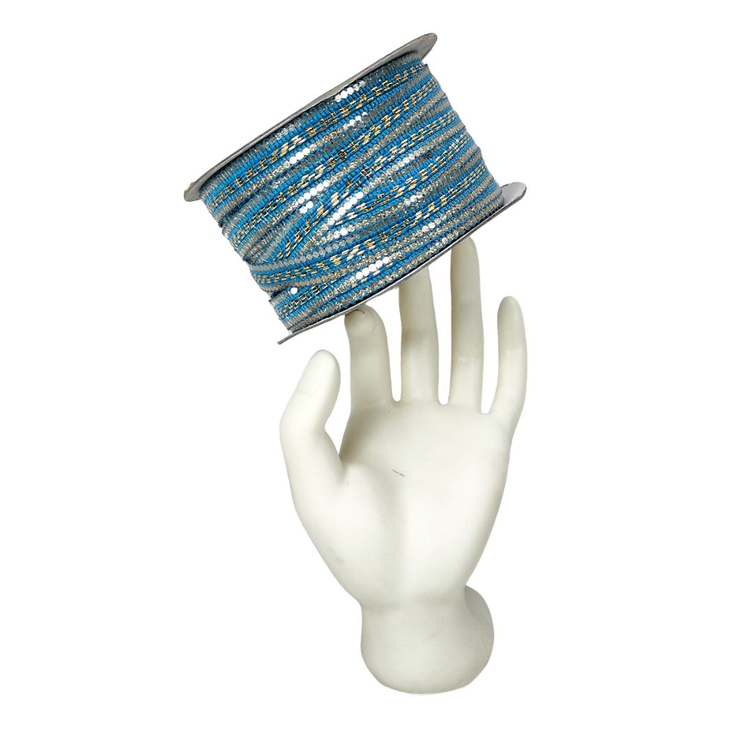 Blue and silver striped ribbon on a mannequin hand against a white background