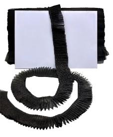 Black pipe cleaner with a white card on a black background