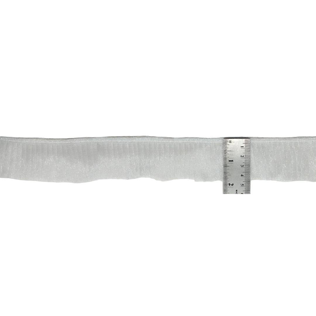 Metallic belt with a ruler for scale on a white background