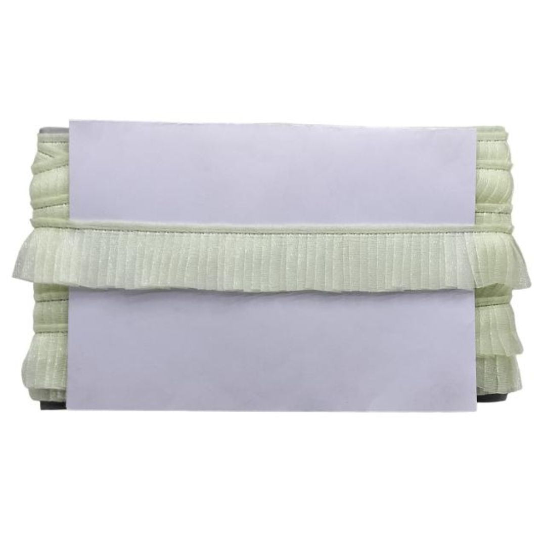 Stack of green textured fabric on a white background