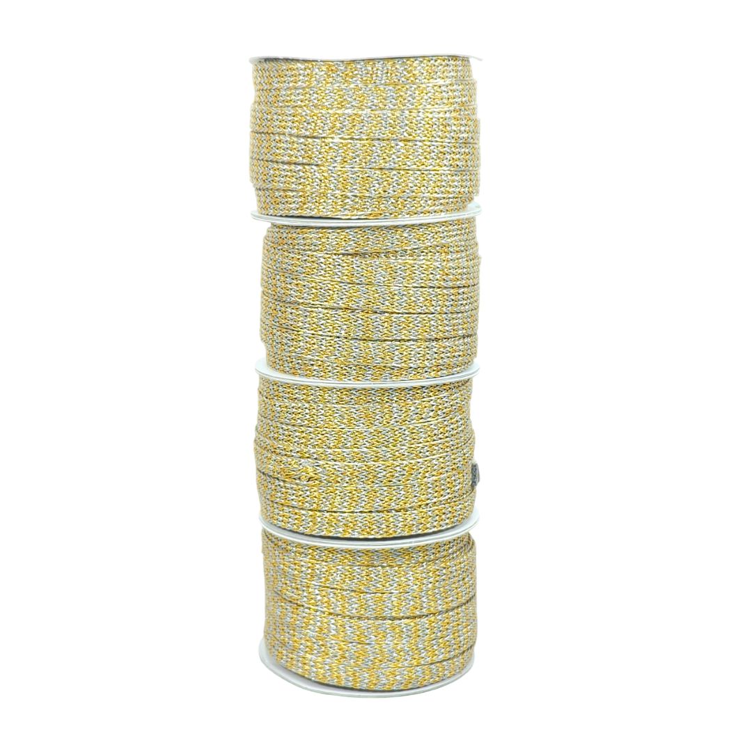 Stack of yellow and white braided cord on a white background