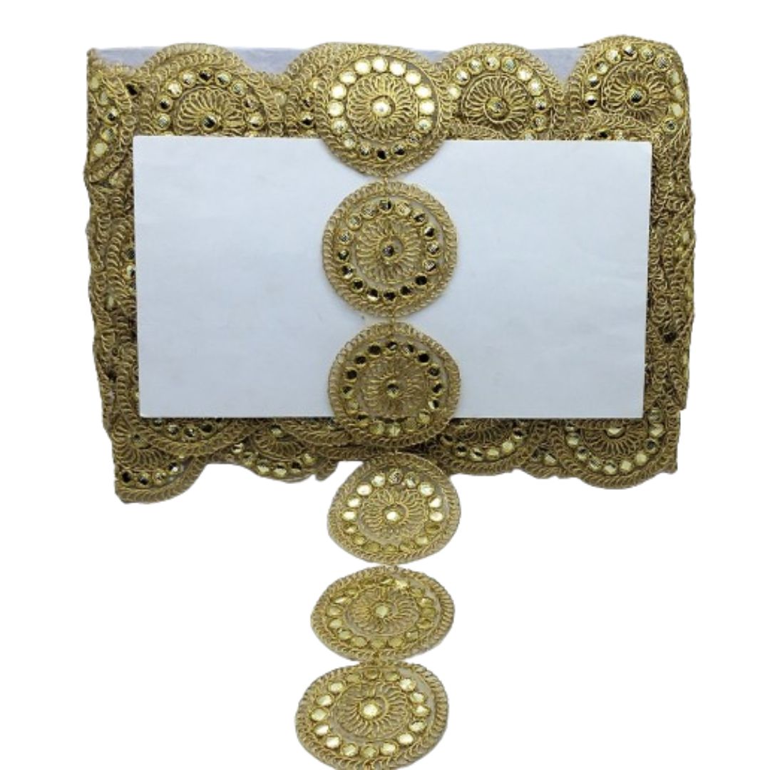 Decorative gold card holder with intricate patterns on a white background