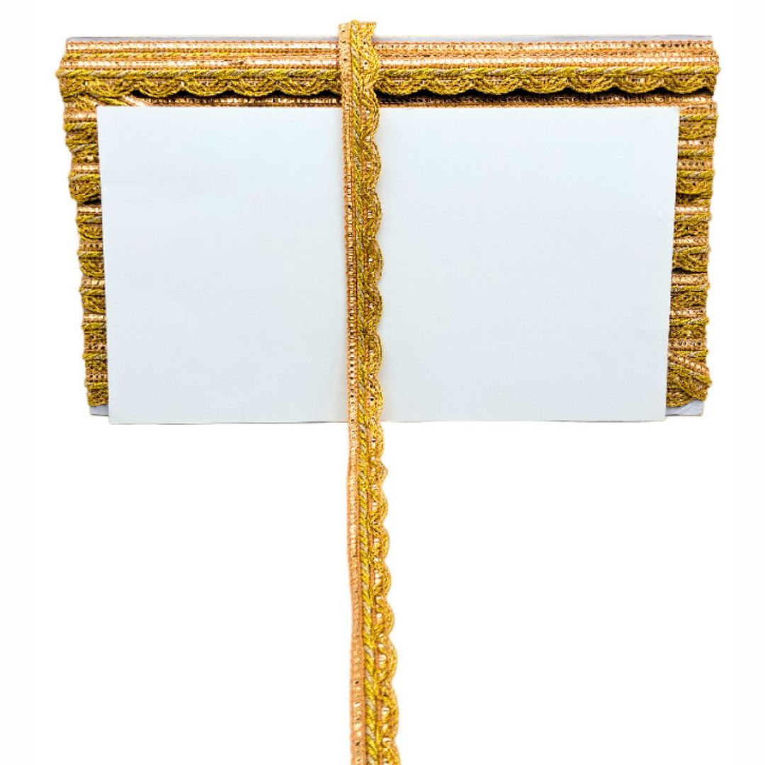 Gold decorative frame with a white center on a white background