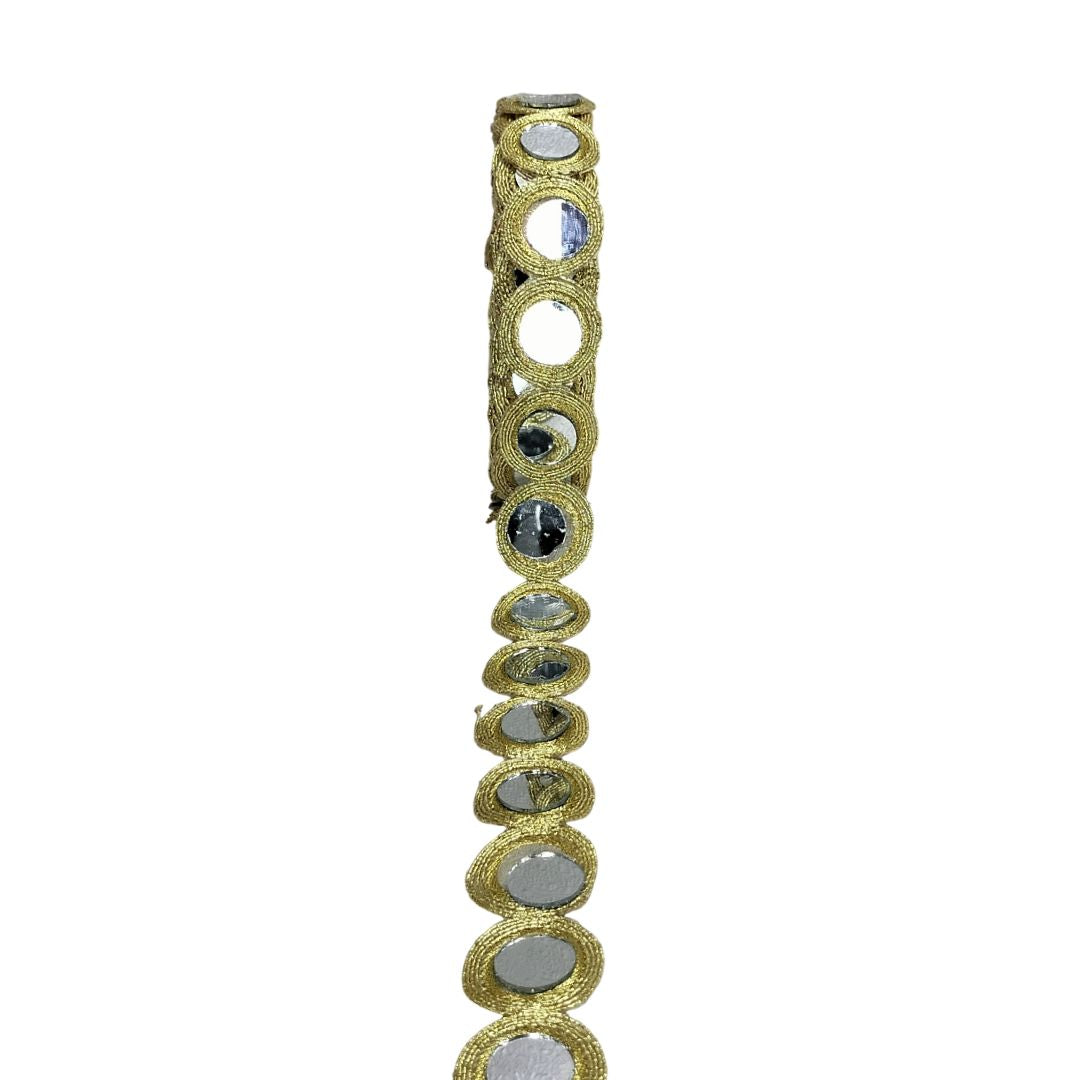Gold bracelet with embedded stones on a white background