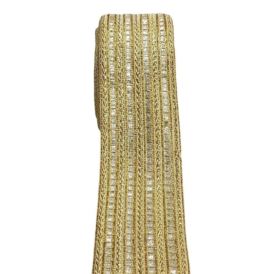 Gold and silver patterned fabric on a white background