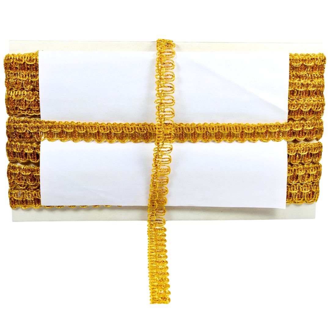 White clutch with gold decorative trim on a white background