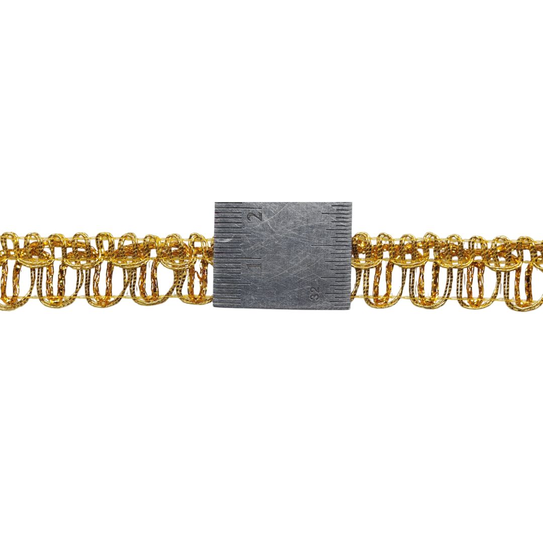 Gold chain with a rectangular metal block in the center on a white background