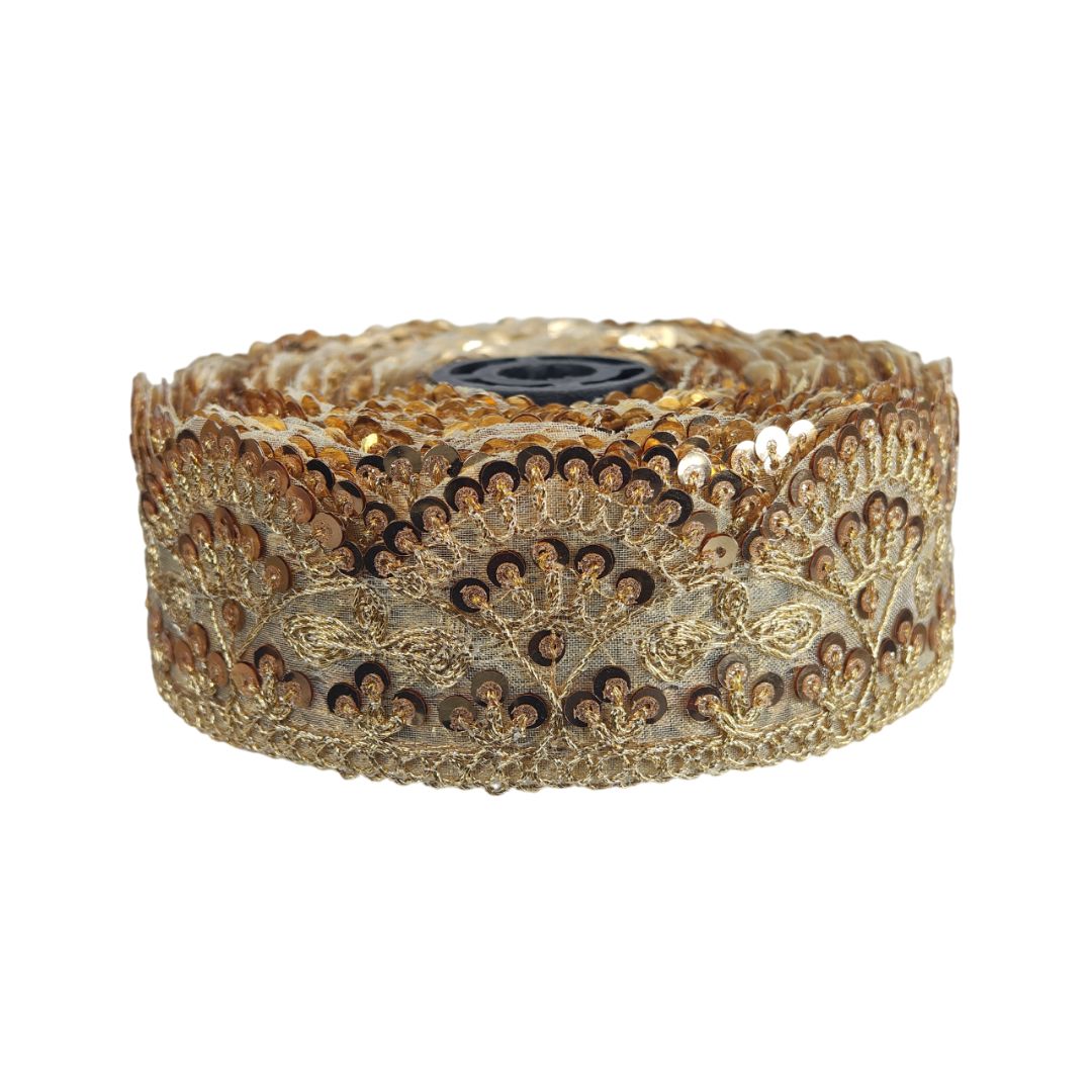 Gold decorative ribbon roll on a white background