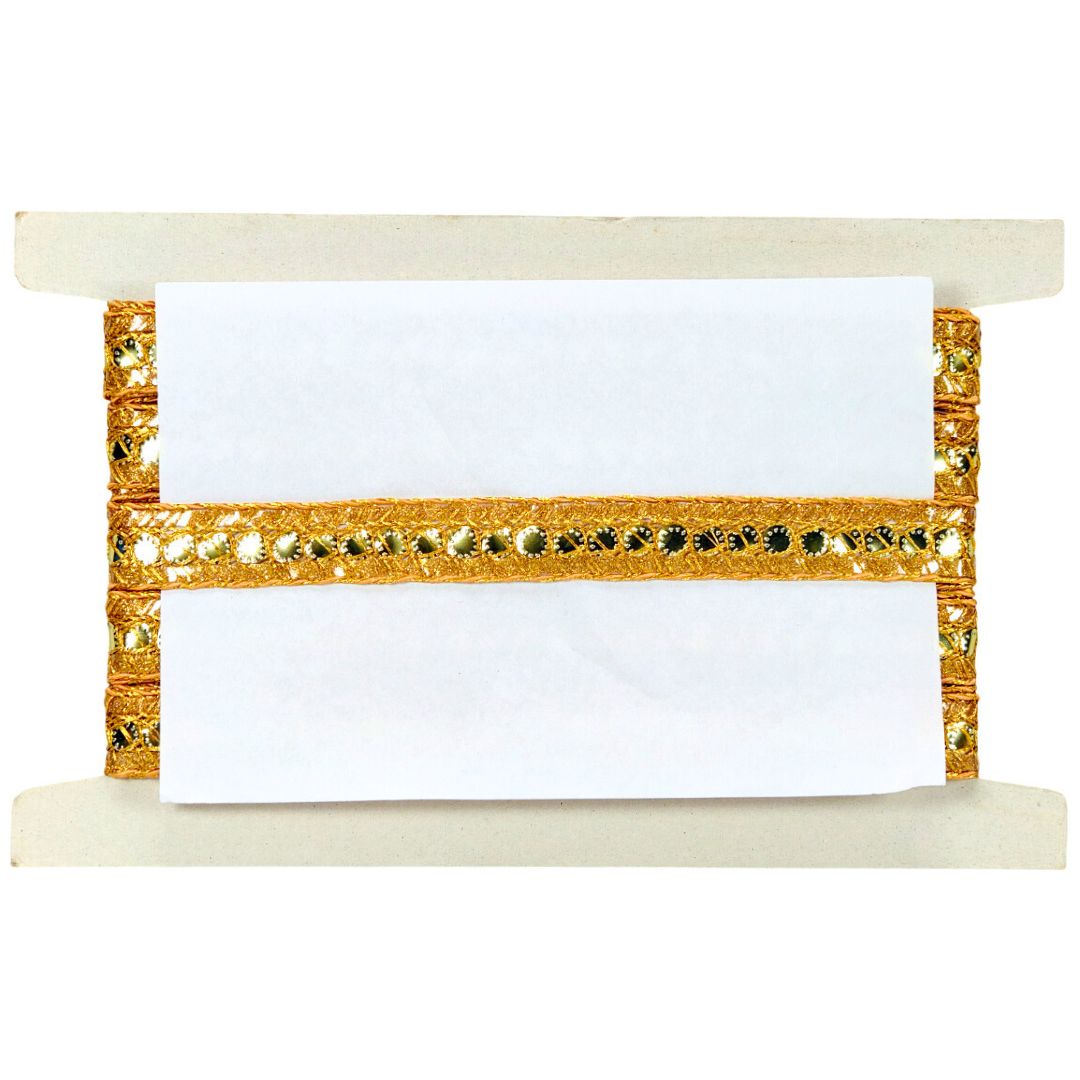 Decorative holder with gold trim and white paper on a white background