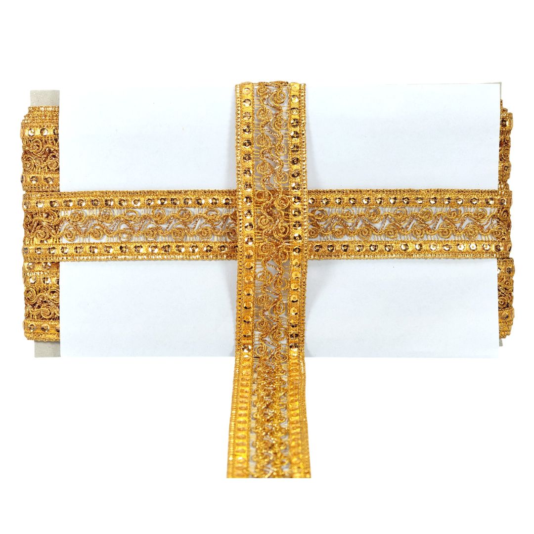 Decorative gold cross on a white background