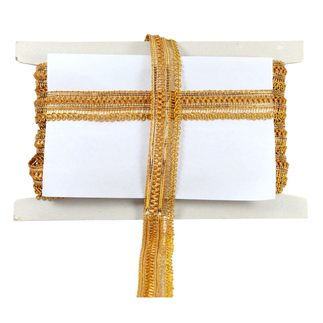 Gold decorative ribbon on a white card with a marble stand