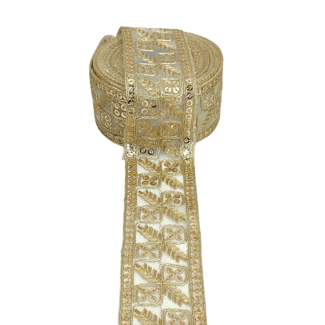 Decorative gold ribbon with intricate patterns on a white background