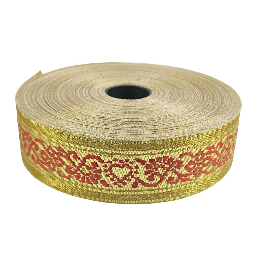 Roll of gold ribbon with red pattern on a white background