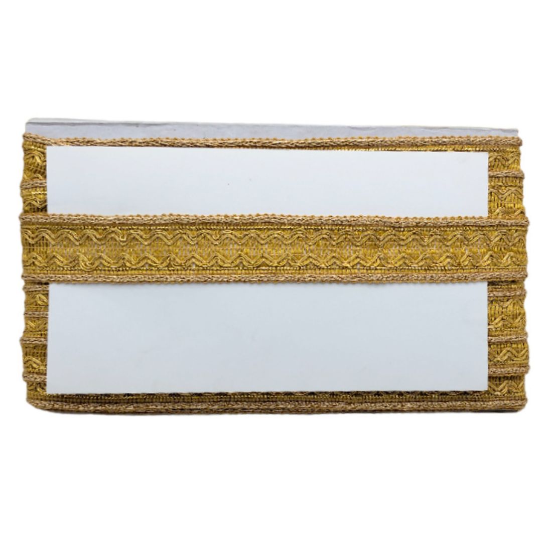 Decorative box with gold trim and white surface on a white background