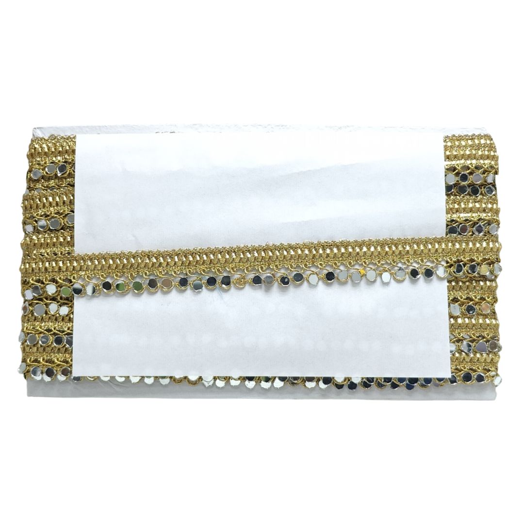 White clutch bag with gold and black beaded trim on a white background