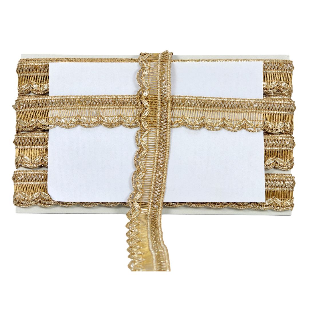 Decorative table runner with gold lace on a white background