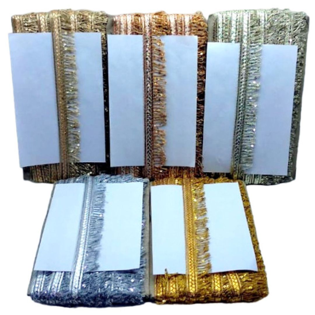 Decorative lampshades with gold and silver fringe on a white background