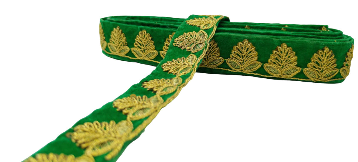 Green ribbon with gold leaf patterns on a white background