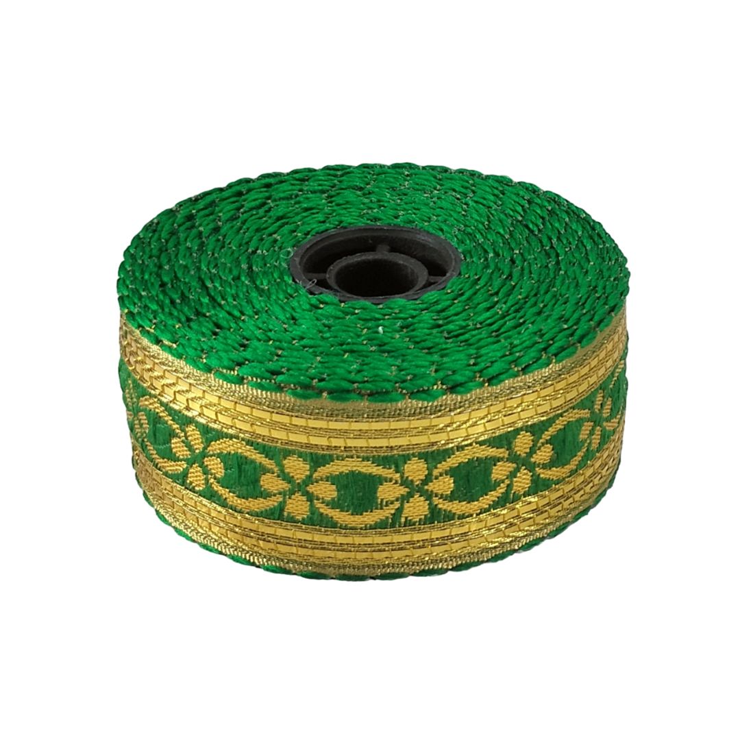 Roll of green and gold braided cable on a white background