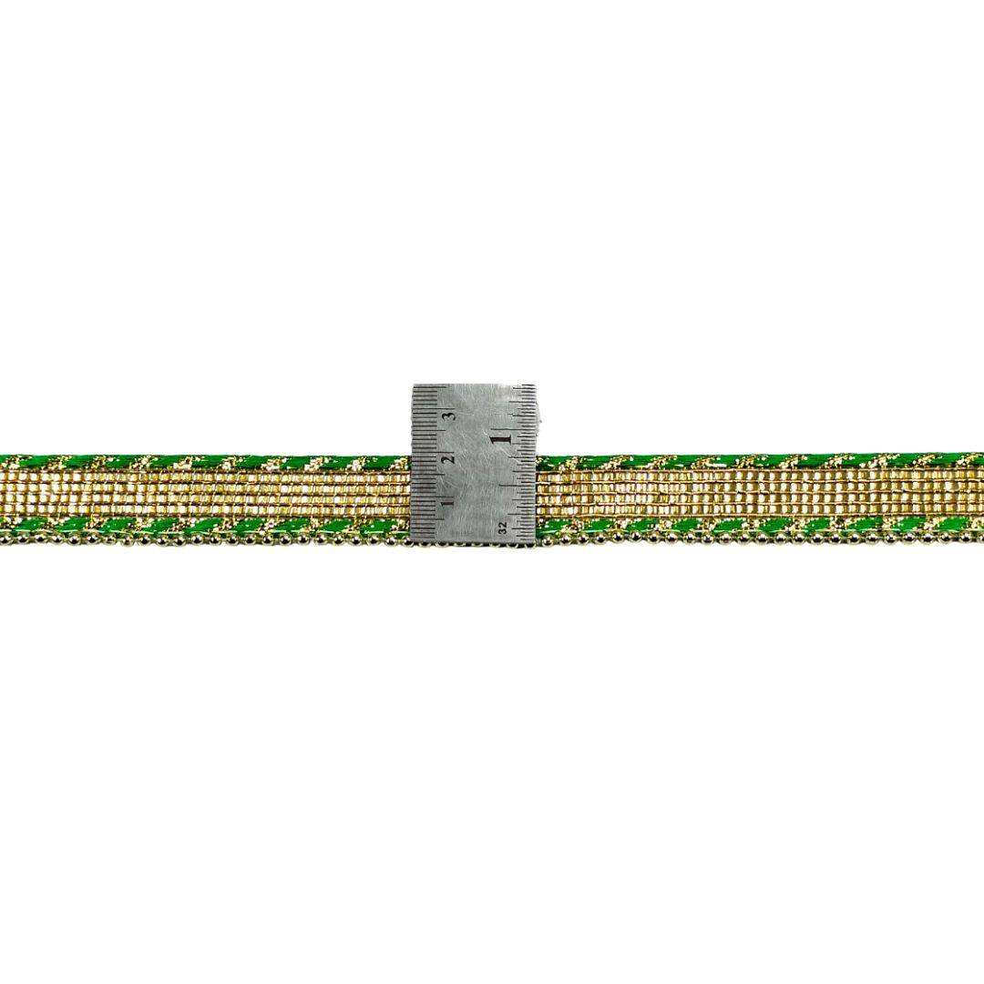 Gold and green braided belt with a ruler for scale on a white background