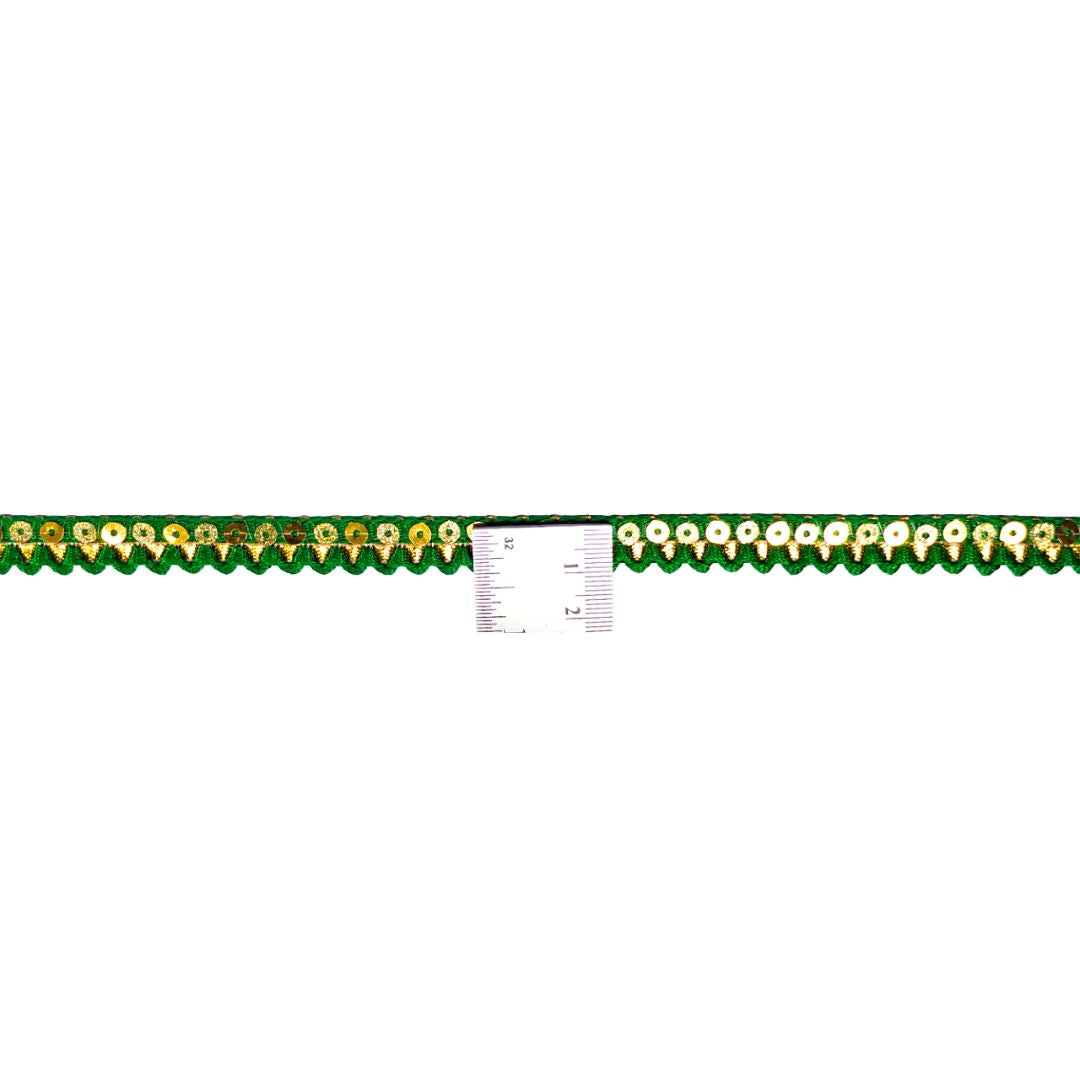 Green ruler with gold accents on a white background