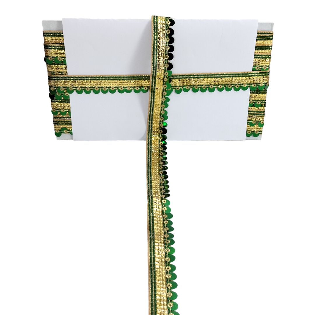 White fabric with green and gold decorative border on a white background