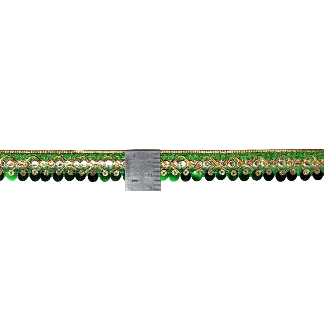 Decorative green border with gold and pearl accents on a white background