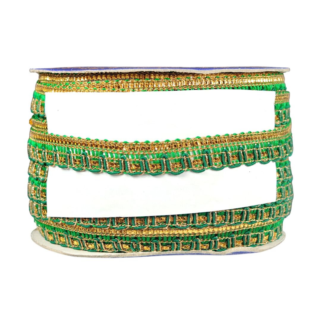 Set of green and gold bangles on a white background