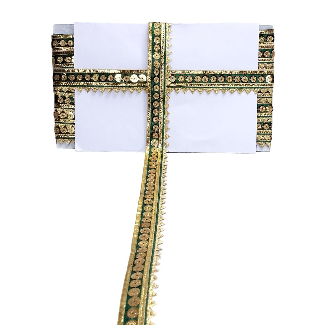 White saree with gold and green border on a white background