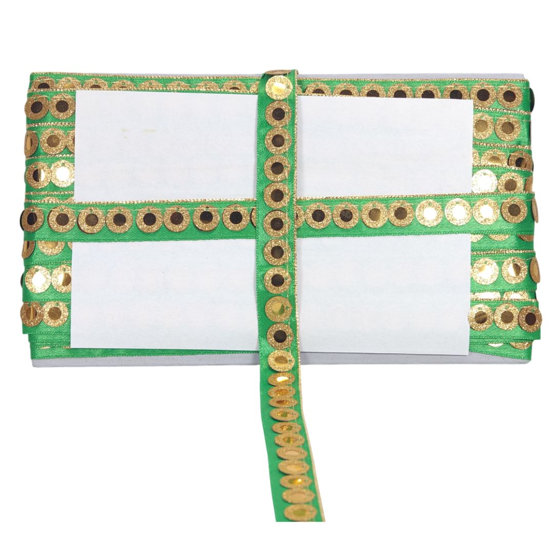 Notebook with green cover and gold decorative border on a white background
