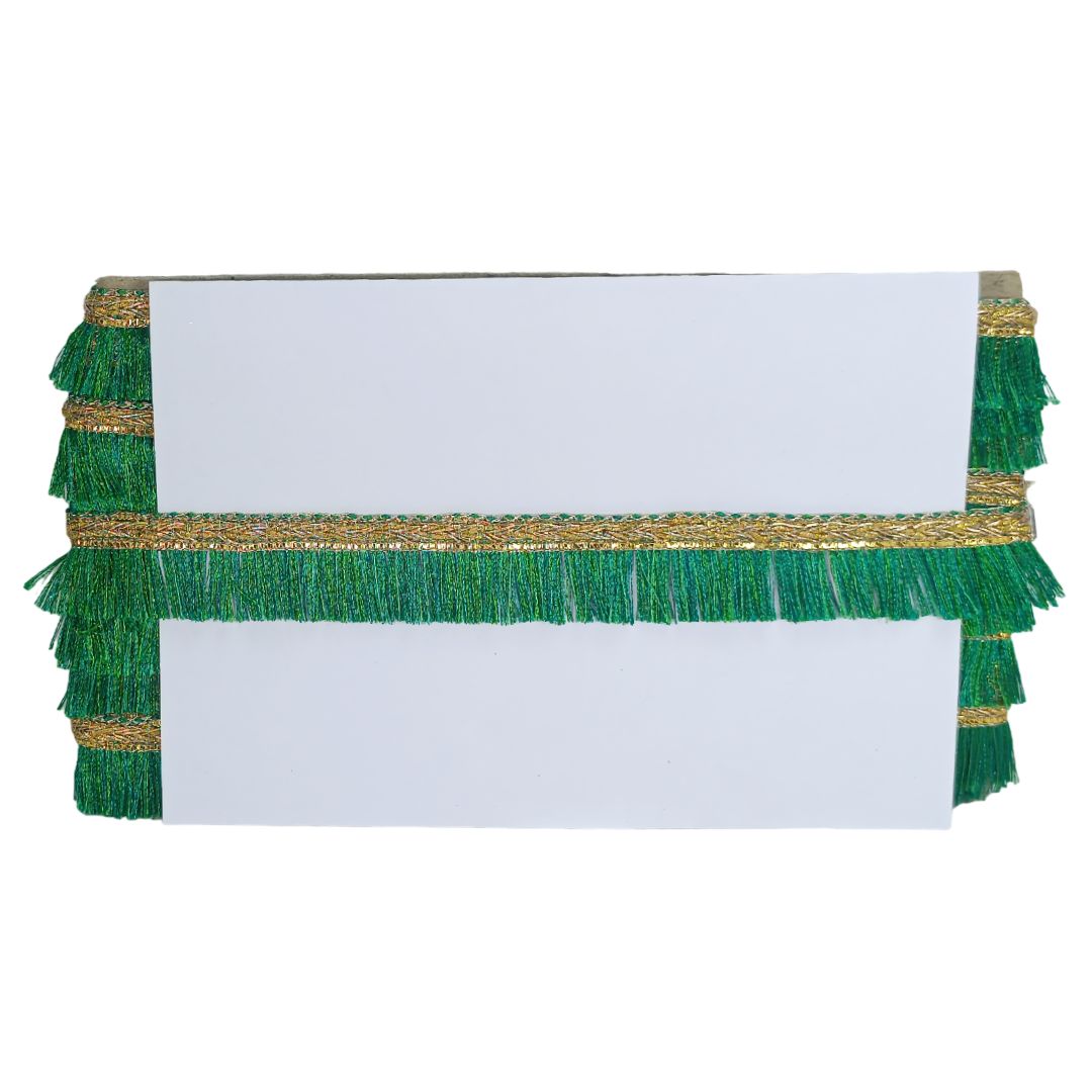 Two white rectangular cards with green and gold fringe on a white background