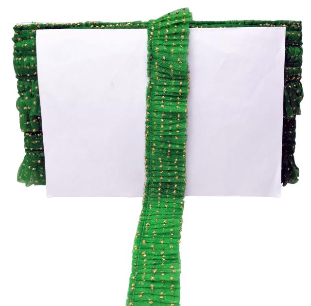 Green decorative ribbon with gold specks on a white background