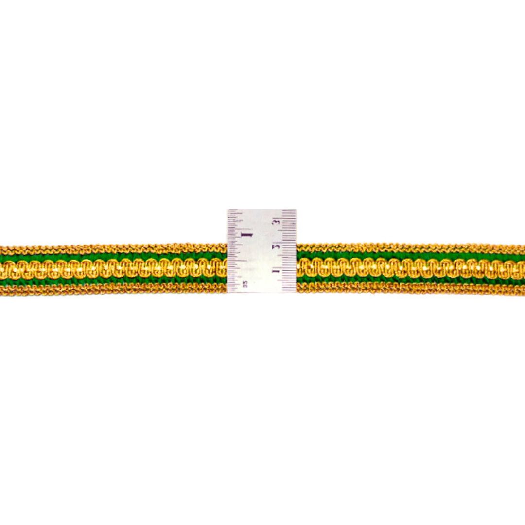 Gold and green braided cable with a ruler for scale on a white background