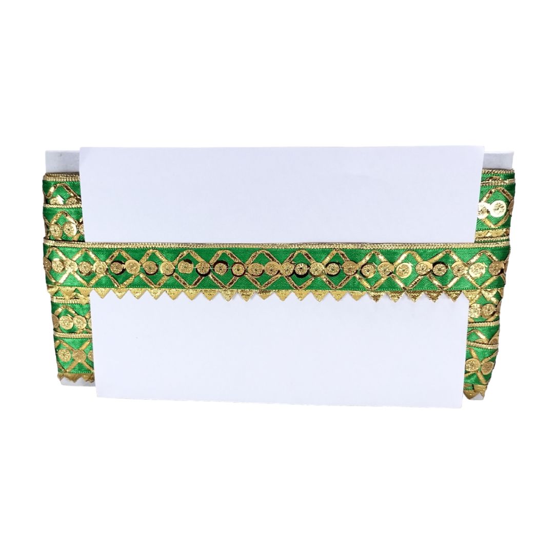 Decorative green and gold border with white paper on a white background