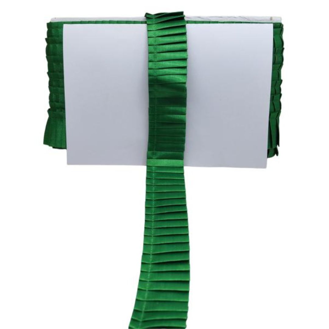 Green pleated ribbon on a white background