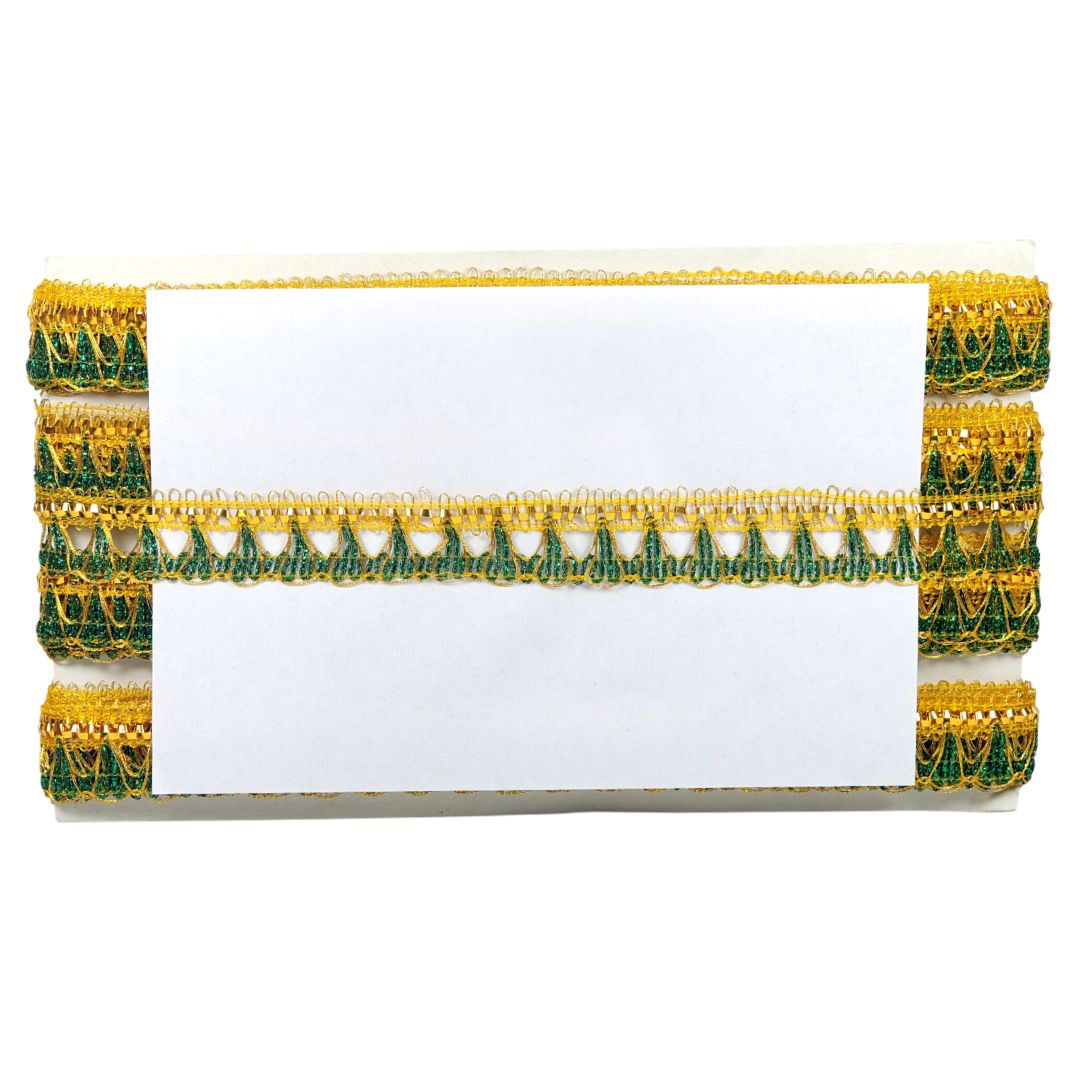 Roll of yellow and green decorative ribbon on a white background