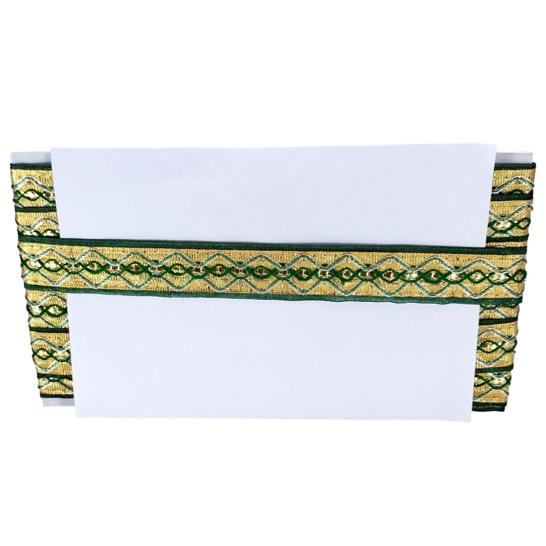 White paper with green and gold decorative border on a white background
