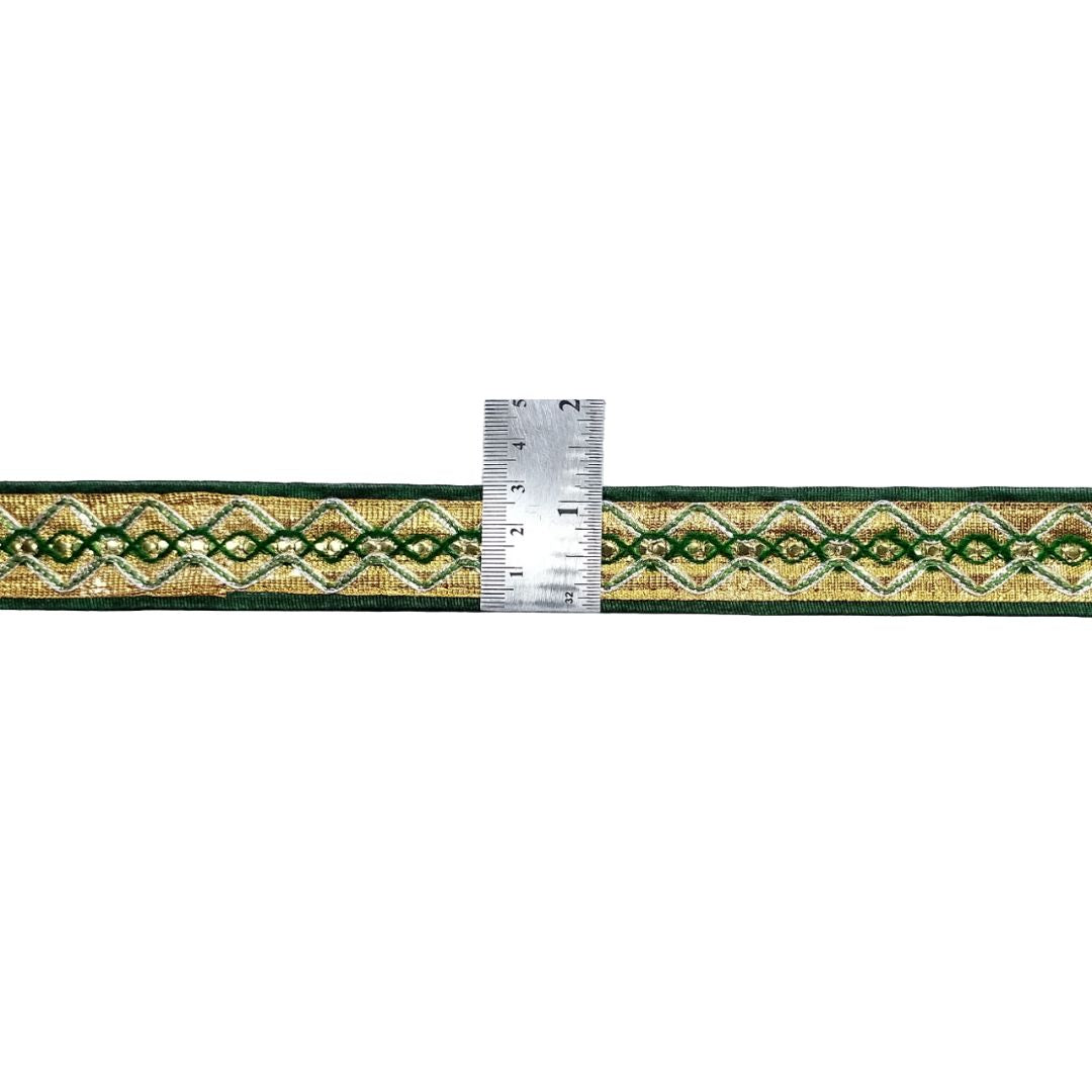 Decorative ribbon with a pattern and a ruler for scale on a white background