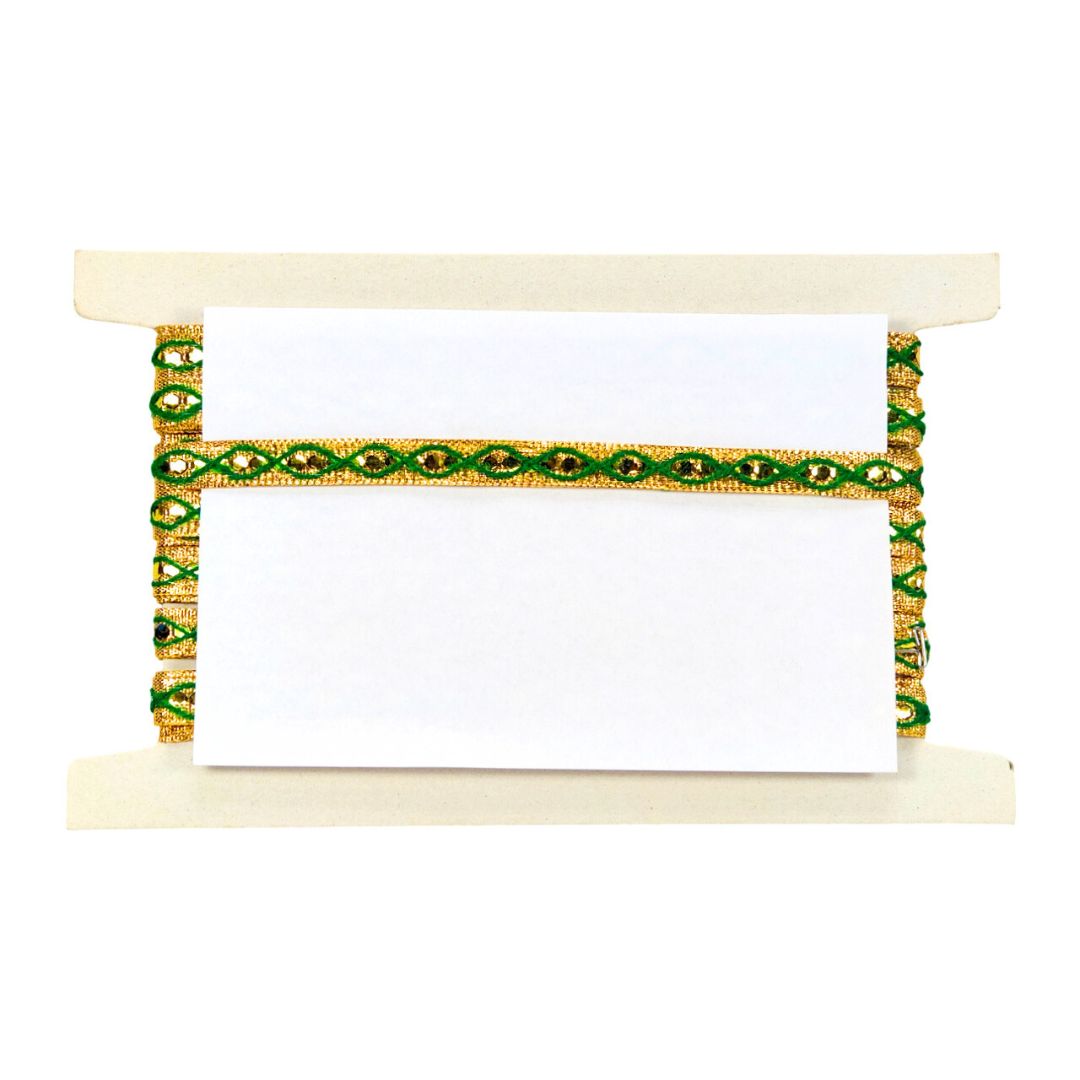 Decorative holder with green and gold pattern on a white background