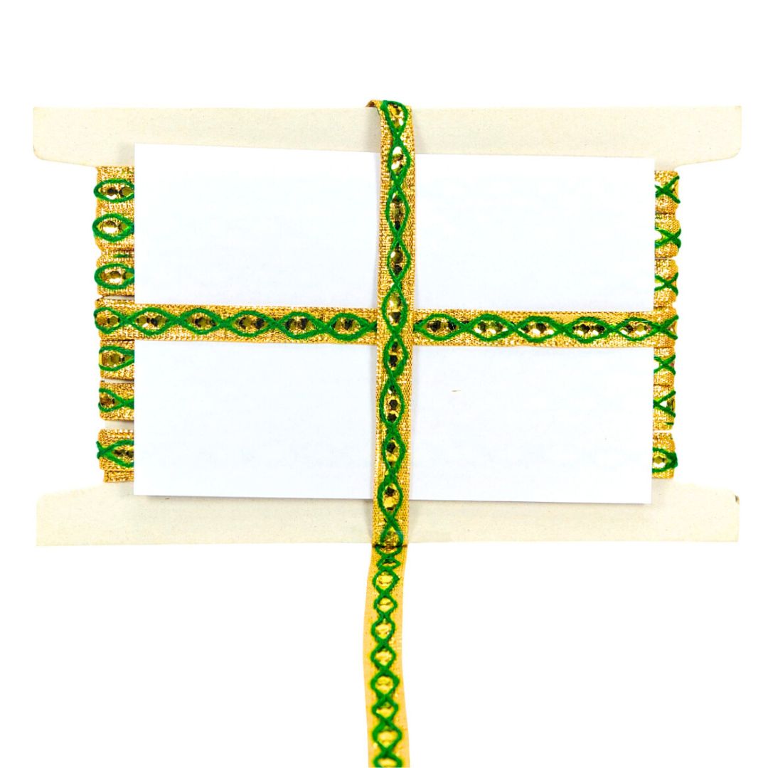 Decorative ribbon with green and gold pattern on a white background