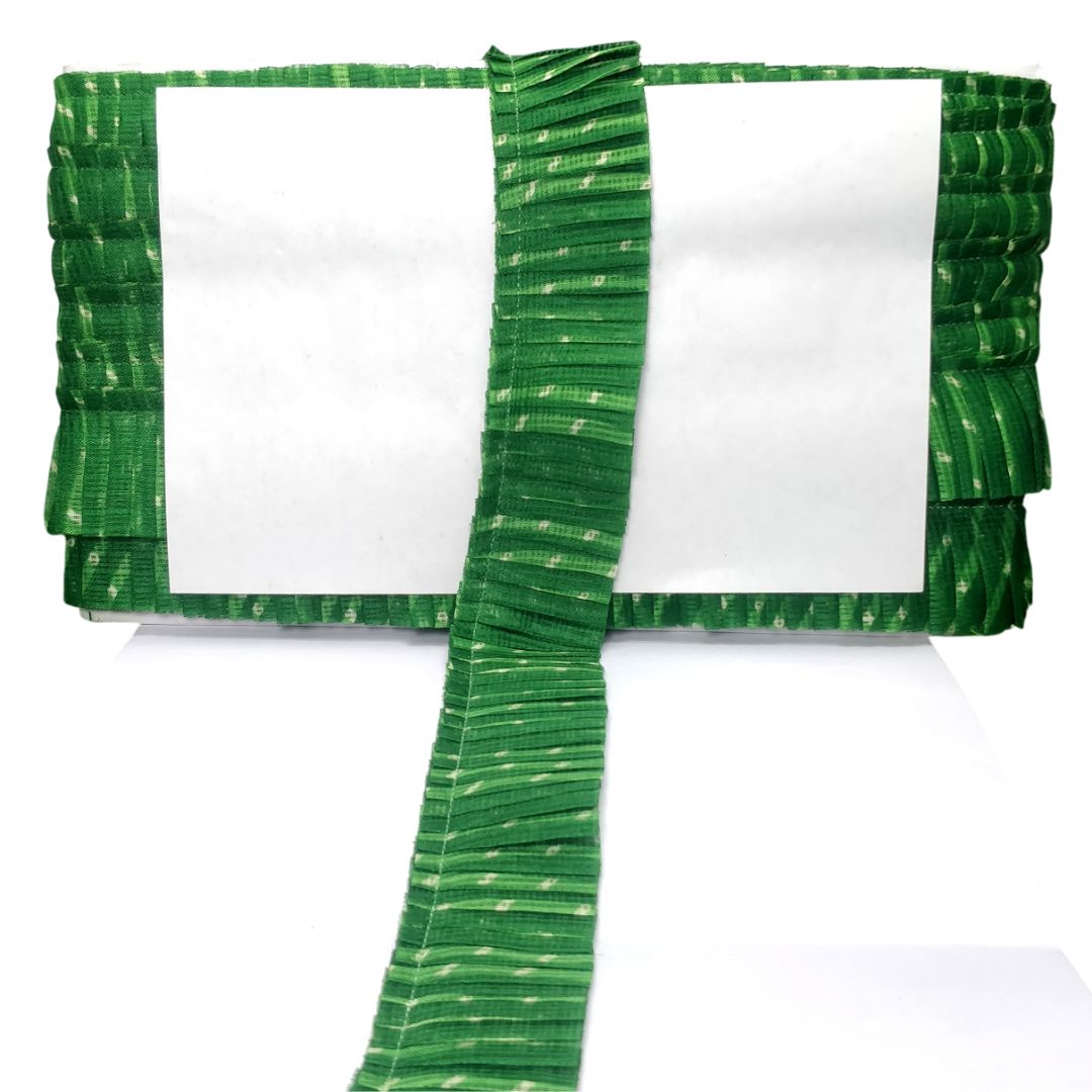 Green ruffled border on a white background