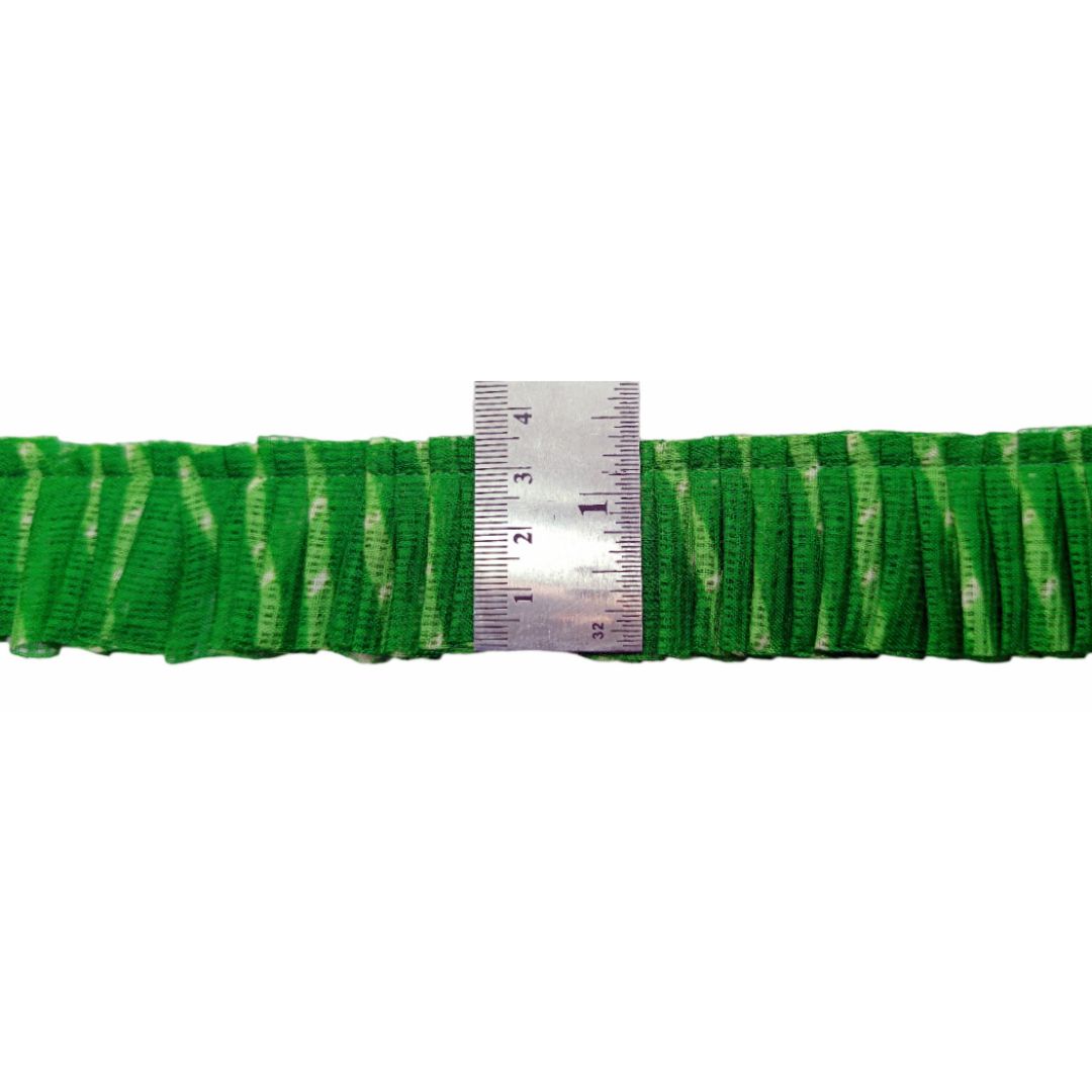 Green belt with a ruler for size measurement on a white background