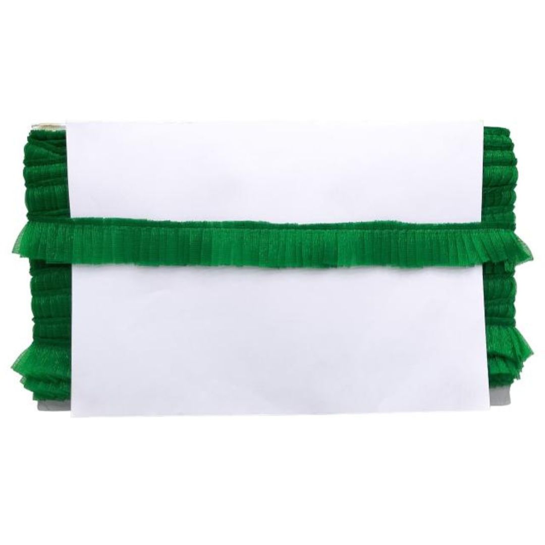 White clutch with green ruffled trim on a white background