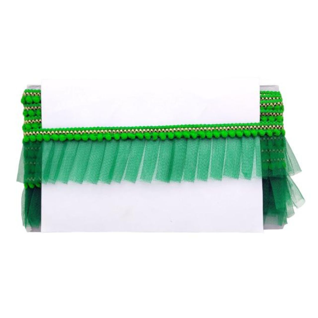 Green brush with bristle head and handle on a white background