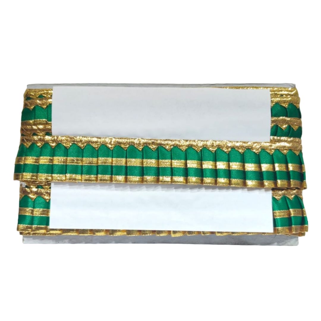 Decorative cornice with green and gold pattern on a white background