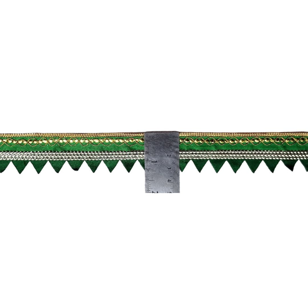 Green and gold border trim with a ruler for measurement on a white background