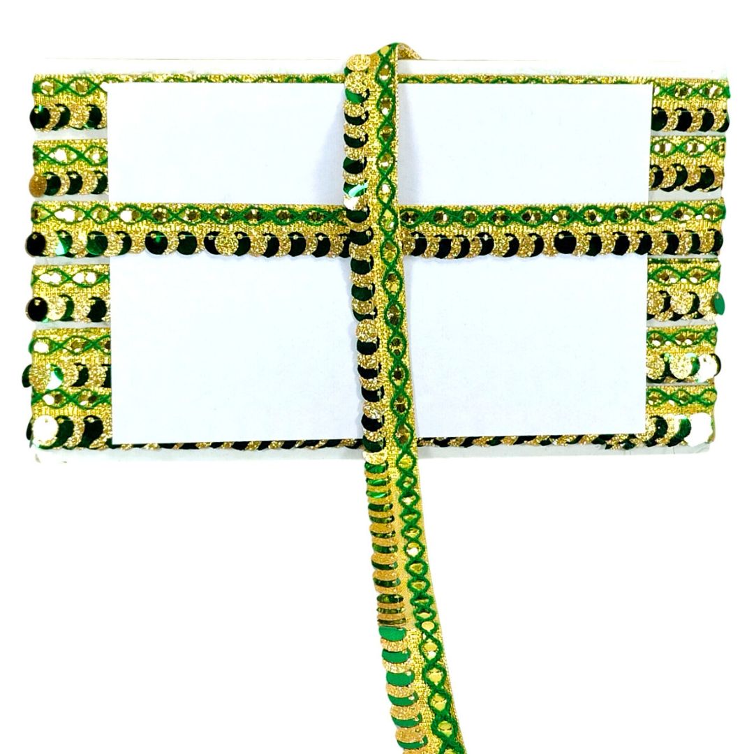 Decorative ribbon with green and gold pattern on a white background